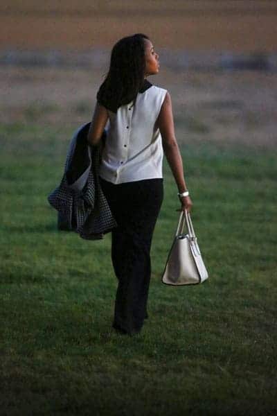 Olivia Pope wearing white top and black pants
