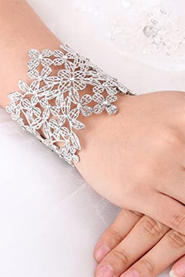 Close-up of art deco cuff bracelet on woman's arm.