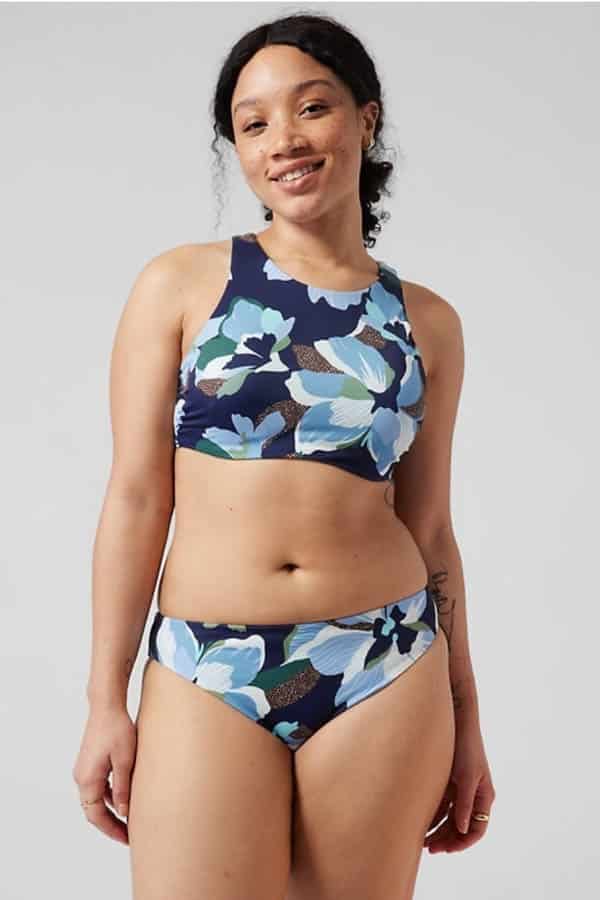 The best stores for end-of-summer swimwear deals 4 Model wears two-piece patterned swimsuit by Athleta.