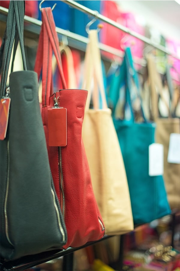 Purses hanging on store rack