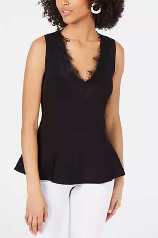 Black peplum top with lace detail at neck