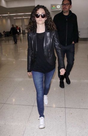 Emmy Rossume wearing jeans and black t shirt