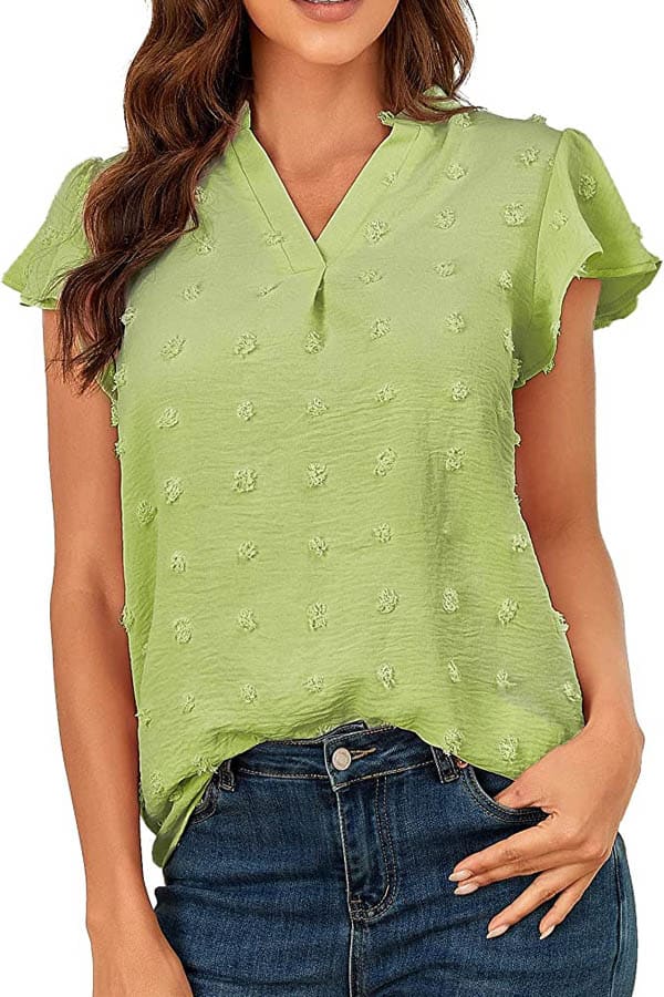 25 summer outfits on the cheap: Get 'em all for $200 5 Close-up of model wearing green blouse with textured details.