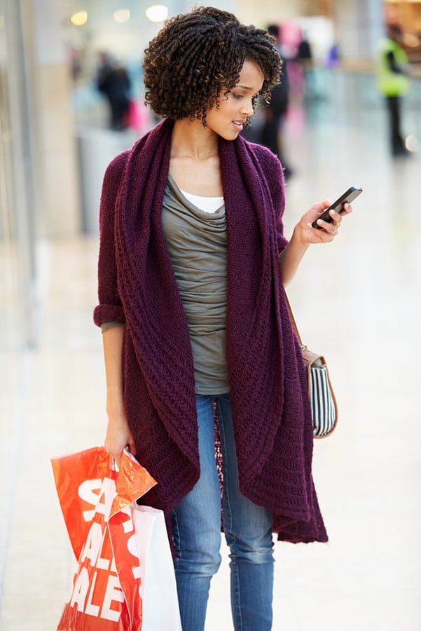 Holiday shopping: 9 ways to save $1,000+ 3 Woman price shopping on her phone