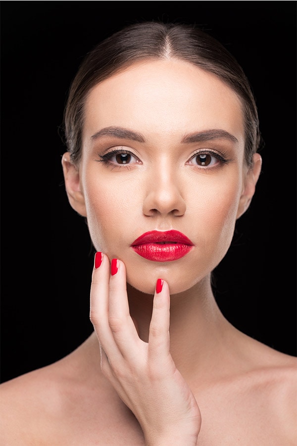 Woman with lipstick and painted nails