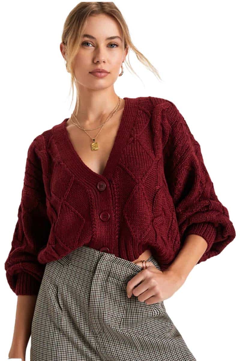 Cozy girl style: The scoop on the TikTok fashion trend 4 Model wears oversized cardigan with checked pants as an example of cozy girl style.