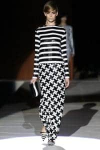Runway model wearing mixed patterns