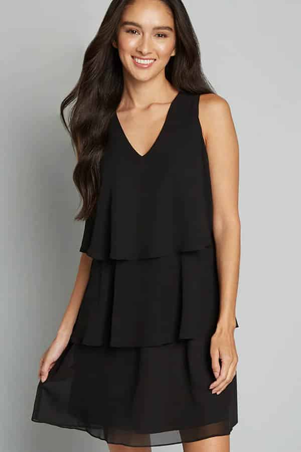 Shop these 14 best fashion and beauty labor day sales & save up to 75% 4 Model wears black shift dress discounted during Labor Day sale at Modcloth.