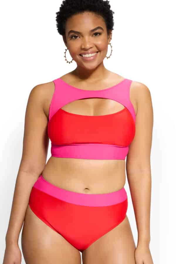 The best stores for end-of-summer swimwear deals 7 Smiling model wears colorblocked swimsuit by New York & Company.