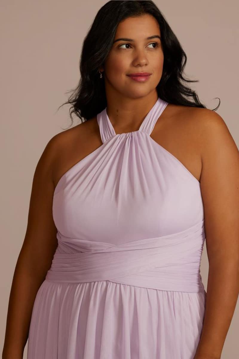 Woman wears lavender bridesmaid dress. 