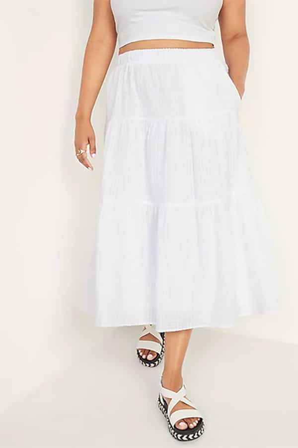 Close up of model wearing white tiered skirt.