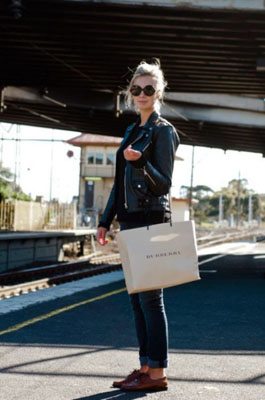 Girl wearing Oxford shoes and moto jacket