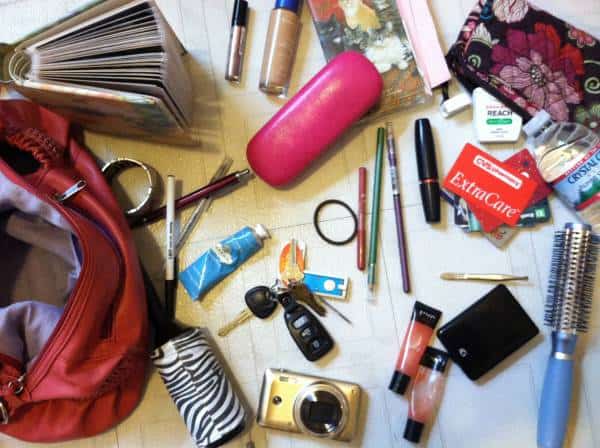 What 6+ pounds looks like in my purse: a camera, water bottle, lint roller, mini photo album (hey, it's good for some #ThrowbackThursday laughs) and of course, beauty products.
