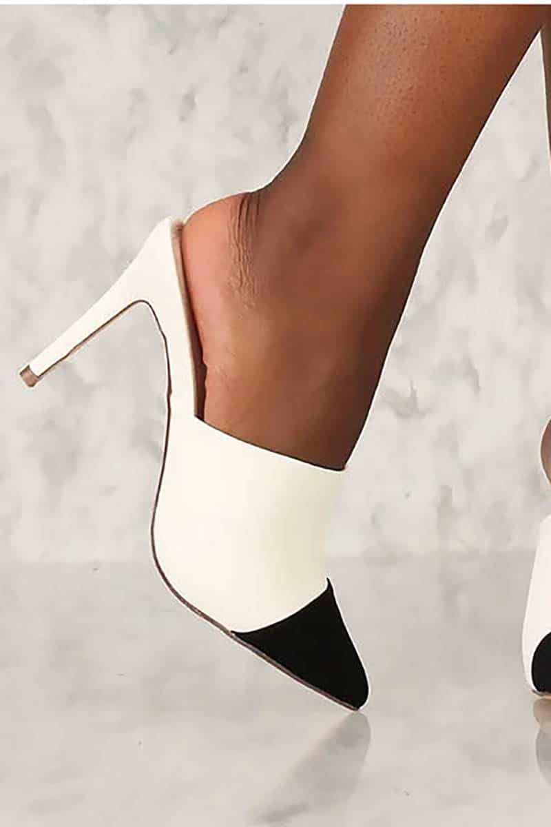 9 more stunning spring shoe trends to shop now 9 Black and white pointed toe, heeled mule.