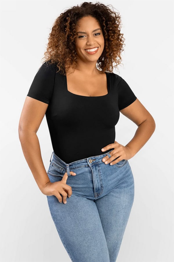 How to style a bodysuit like an off-duty model 4 Woman wearing bodysuit with jeans.