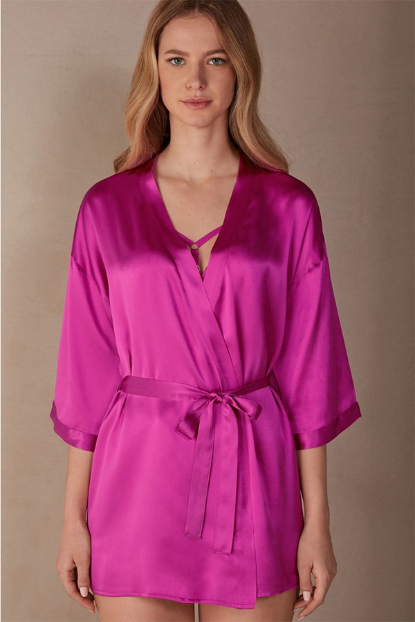 Model wears hot pick silk robe.