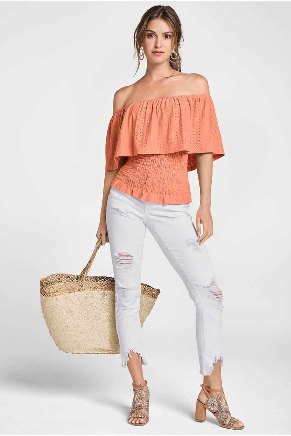 Model wears off-shoulder top.