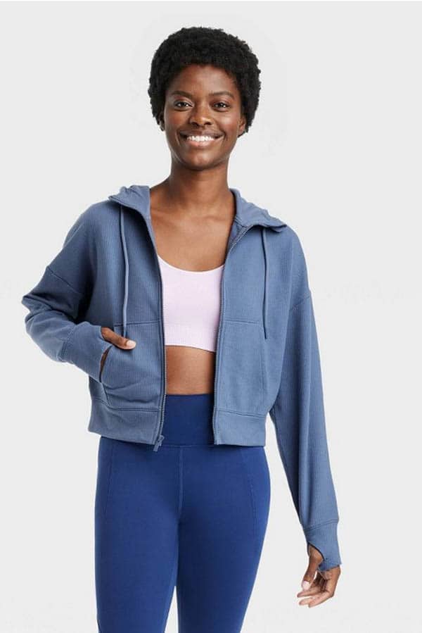 9 best online stores to buy affordable workout clothes for women 7 Model wears cute cropped sweatshirt from Target.