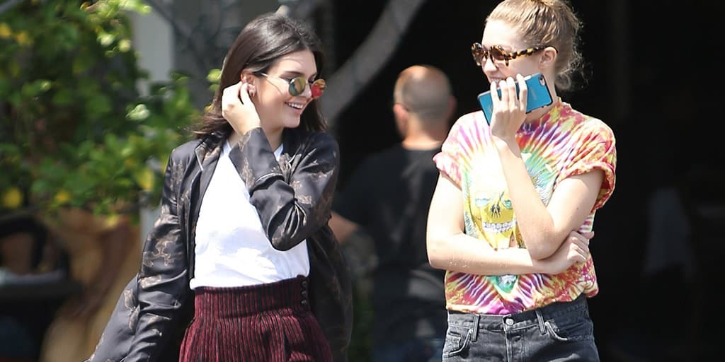 Kendall Jenner and Gigi Hadid, with Gigi wearing tie-dye