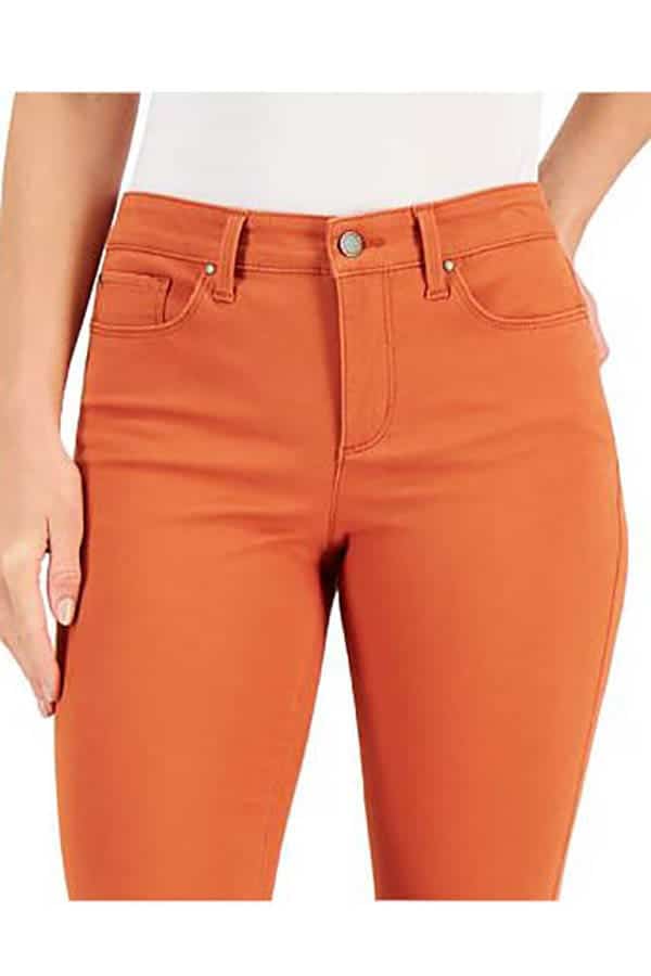 Mid-hip view of model wearing orange jeans for petites.