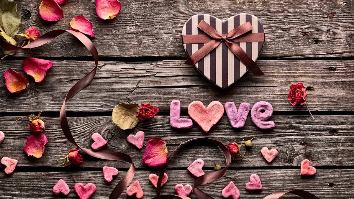 Wood background with hearts, a Valentine's Day concept.