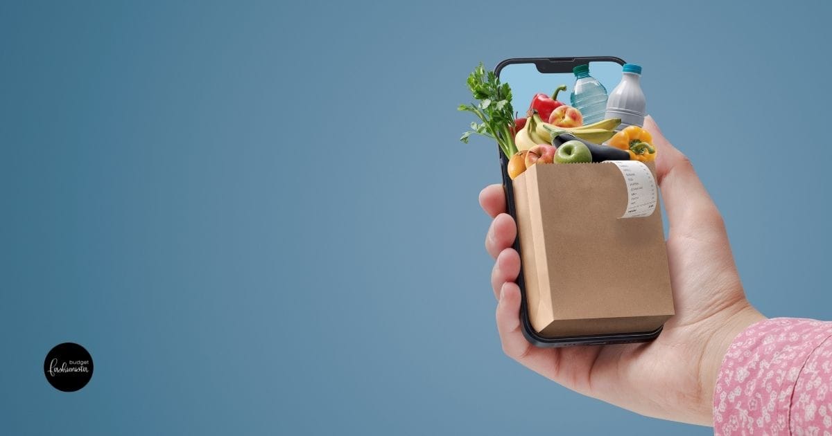 Online shopping concept -- mobile phone with a small bag of groceries.