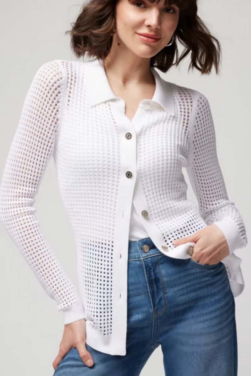 Woman wears white cardigan with an open stitch.
