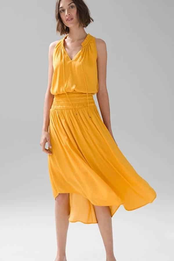 Shop these 14 best fashion and beauty labor day sales & save up to 75% 3 Model wears yellow satin dress on sale at White House Black Market.