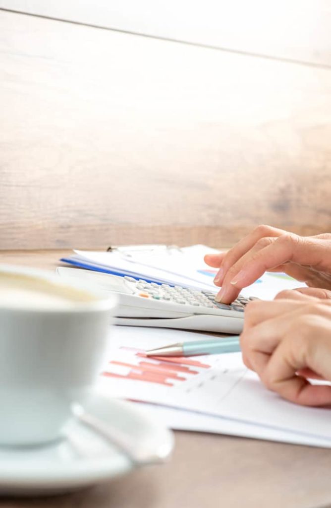 Holiday shopping: 9 ways to save $1,000+ 2 Ways to save — close up of woman budgeting