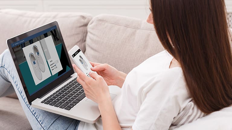 Woman shopping for shoes online.