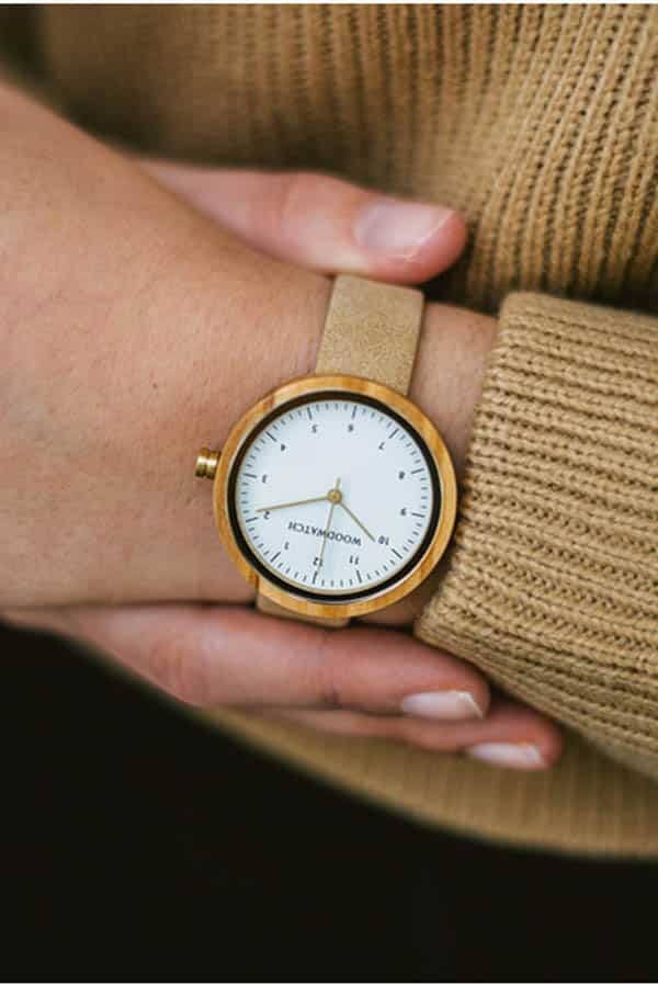 Give good: 9 charity gifts fashion enthusiasts will love 3 Close up of woman's arm wearing watch from charity brand Woodwatch.