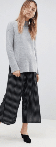 Tall woman wearing long top and wide-legged capris