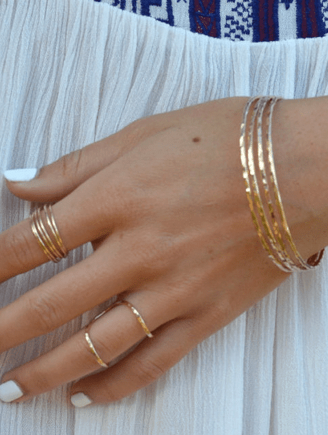 Necklace layering — the pieces to get you started 7 Set of bangle bracelets and stacked rings