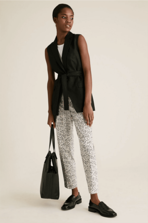 Model wearing printed pants.