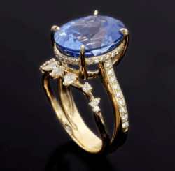 5 steps to designing your own wedding ring on a budget 5 Ring with large blue stone and custom setting