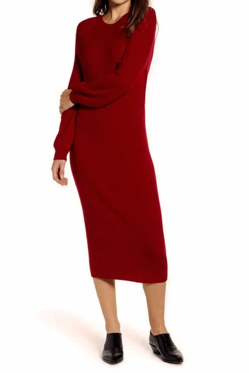Model wearing red midi sweater dress against white background.