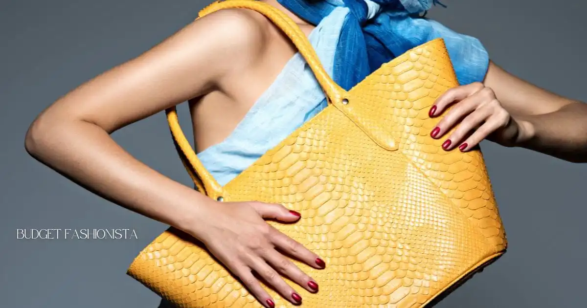 Close up view of giant yellow bag held by fashionable woman.