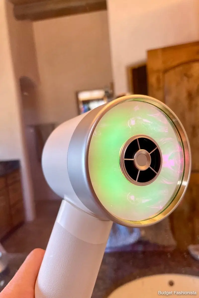Close-up of Zuvi Halo hair dryer turned on to show light.